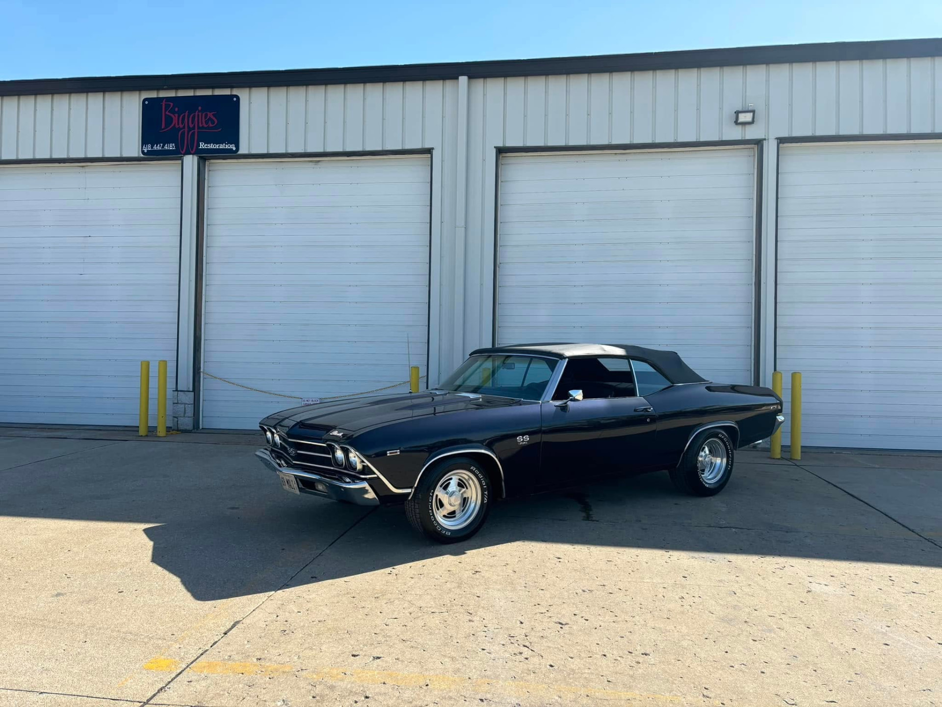 Dark blue Chevelle convertible finished outside the Biggies Restoration shop